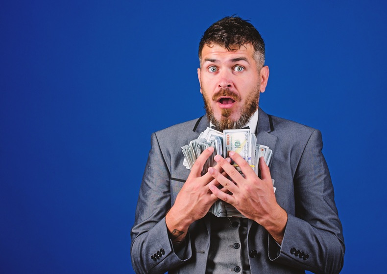 Man with large stack of cash