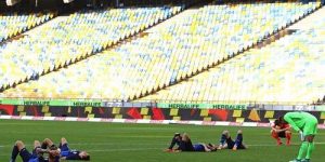 Football players lying on pitch