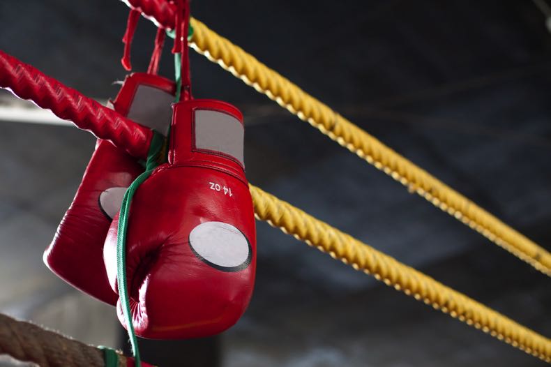 Boxing ring with gloves